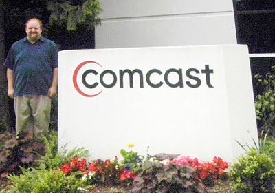 David vs. Goliath: Robb Topolski poses in front of Comcast Headquarters